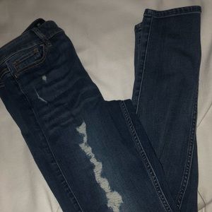Medium blue wash, distressed, denim, high rise, super skinny pair of jeans